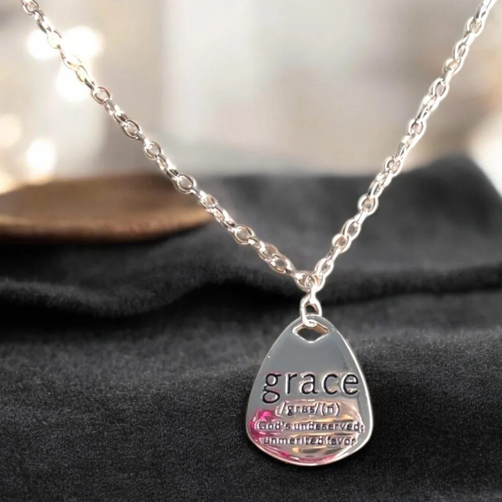 Grace Pendant Necklace in Silver toned and stainless steel. 18” long